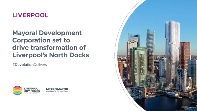 Aerial view of Liverpool's North Docks with modern skyscrapers under clear blue sky, highlighting urban transformation.