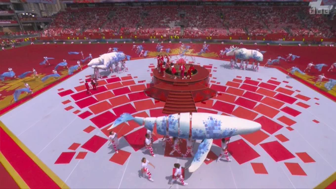 Puppet animals circling a singer