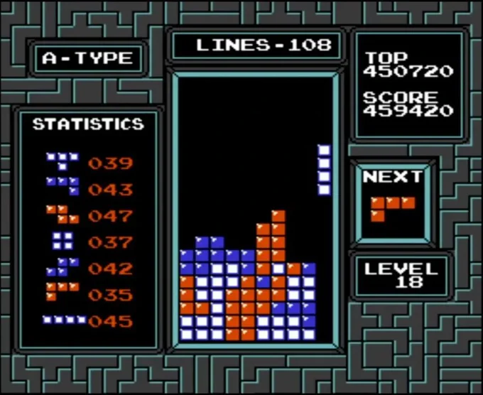 Classic Tetris game screen showing a mix of blue, white, and red blocks with 108 lines cleared and a score of 459,420 at level 18