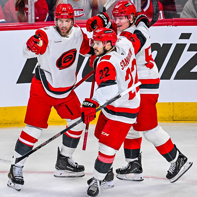 Taylor Hall, Logan Stankoven, and Jackson Blake celebrate after a goal in Montreal.