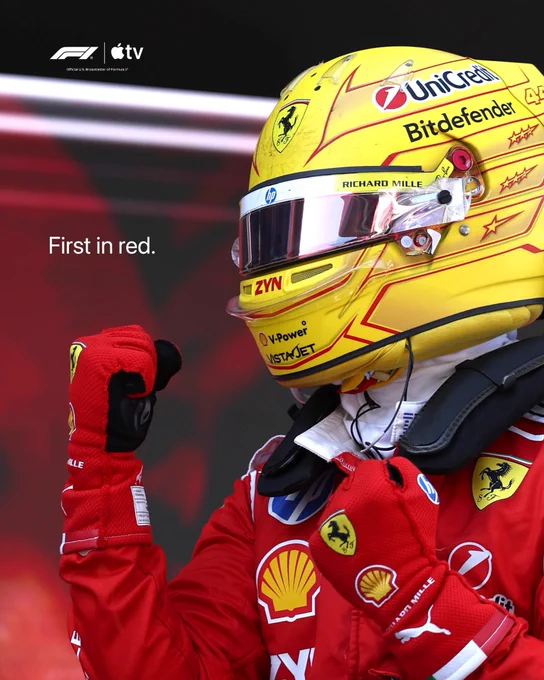 Lewis Hamilton celebrates his win at the Barcelona Race. Text on image reads “First in red.”