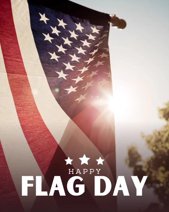 A close-up of an American Flag flying on a house.