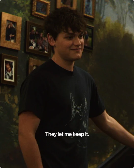 From Cape Fear. Joe Anders as Zack Bowden, slightly smiles while standing on a staircase. “They let me keep it” is written in white text at the bottom of the image.