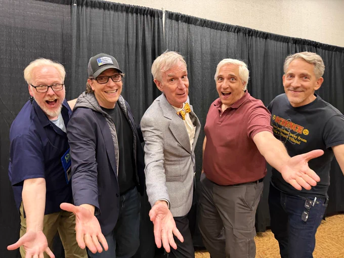 Evan, Jay, Bill Nye, Steve, and Bob reaching toward the camera