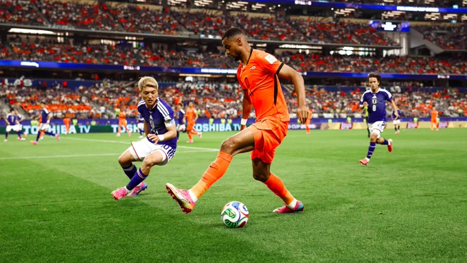 Photography of Cody Gakpo in action for Netherlands against Japan at the 2026 World Cup. The match finished 2-2.