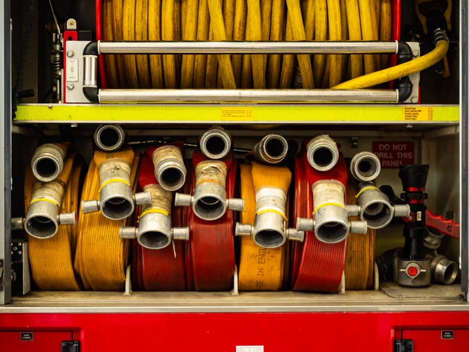 Hose reels in the side of a fire engine