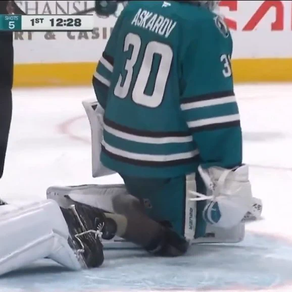 Yaroslav Askarov on the ice without on of his leg pads 