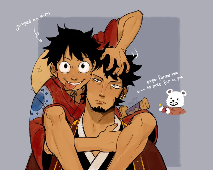 Law and Luffy from One Piece. They are in their Wano Arc outfits, Luffy is climbing on Law's shoulders, aggressively petting his hair while sticking his tongue out at the camera. Law is uninterested, letting Luffy do as he likes. An arrow points at Luffy that reads: "Jumped on him" Another arrow points at Law, it reads: "Bepo forced him to pose for a pic" with a small Bepo doodle next to it.