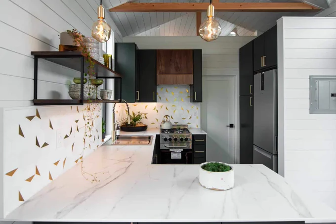 Cascade Max kitchen with marble counters and brass accents