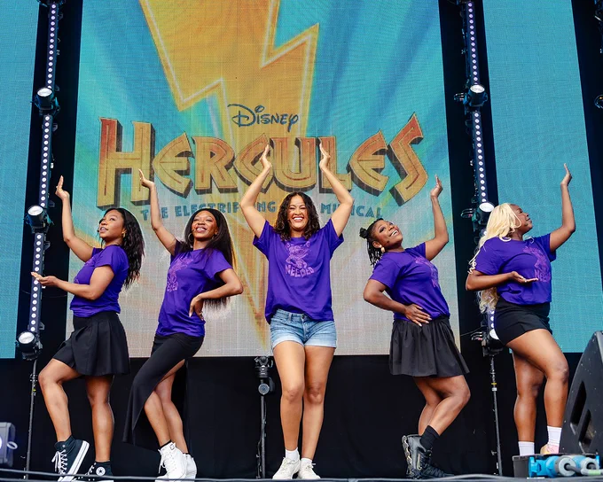 A photo of the cast of Disney's Hercules performing on stage at West End LIVE.