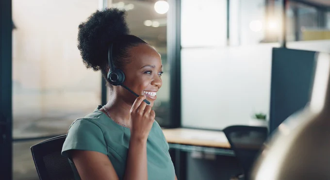 Young woman with telephone headset smiling