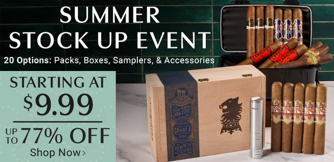 Summer Stock Up Event advertisement for cigars. Displays various cigar packs, boxes, samplers, and accessories. Pricing starts at $9.99 with discounts up to 77% off. Cigars included are Drew Estate Undercrown Maduro, Ave Maria, Drew Estate Chateau Real Habano, Ave Maria Excalibur, Camacho Corojo, and Oliva Master Blends III. - Cigar.com 