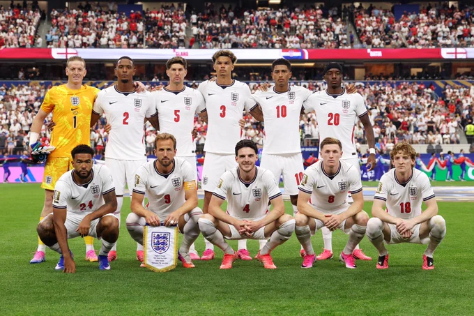 The England XI line up for a team photo before the game