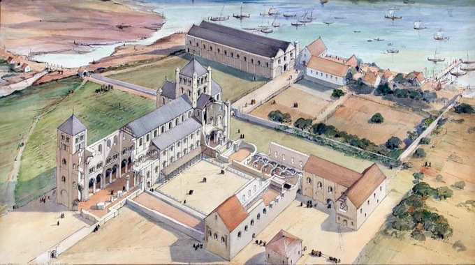 A detailed illustration of a medieval monastery complex set in a coastal landscape. The architecture features stone buildings with towers and arched windows surrounding a central courtyard. Pathways and small figures of people on horseback or walking are visible. In the background, ships sail in a calm body of water near the shore, with green fields and sparse trees in the surrounding area.